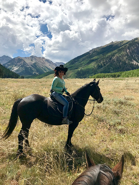 Picture of Ruth Kruger riding horses in Carbondale, Colorado